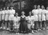 Esther and Leonie bracket Miss Smith for the Strathcona H.S. Badminton Team - 15 yrrs. old [c. 1947]